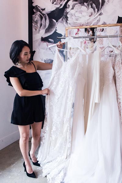 Angela Kim with a few of her couture wedding dresses