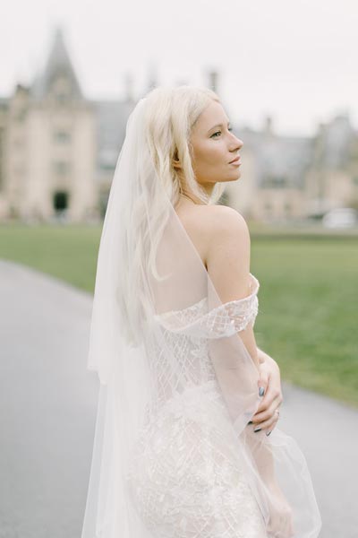 Aleksa wearing her custom wedding dress from Angela Kim Couture