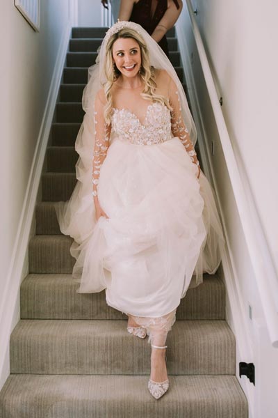 Breigh wearing her custom wedding gown from Angela Kim Couture