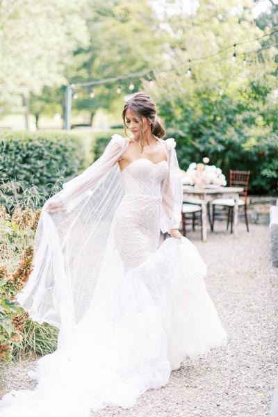Oksana wearing her custom wedding gown from Angela Kim Couture