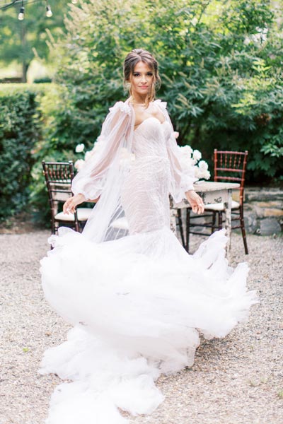 Oksana wearing her custom wedding gown from Angela Kim Couture
