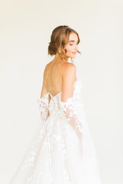 Rebekah wearing her custom wedding dress from Angela Kim Couture