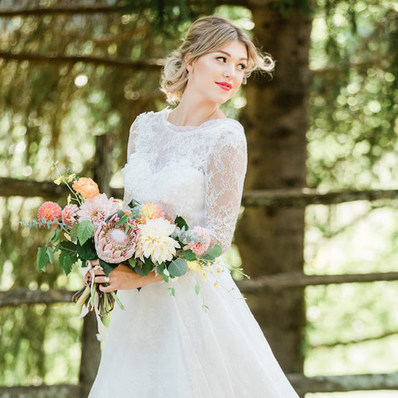 Taylor in a custom Angela Kim wedding dress with 3D floral embroideries
