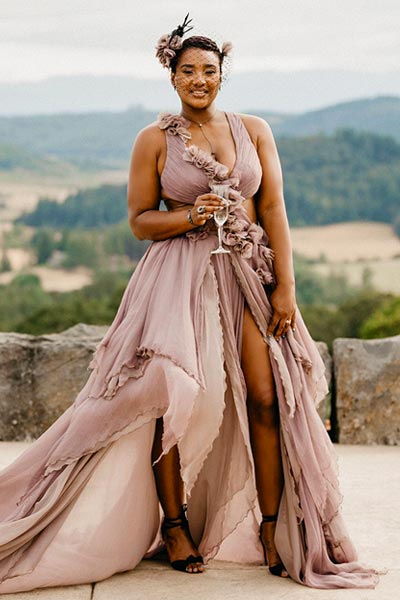 Marve wearing a Beyonce inspired custom purple silk wedding dress