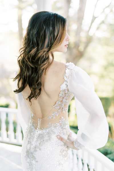 Beautiful U shaped back on this couture wedding gown from Angela Kim Couture