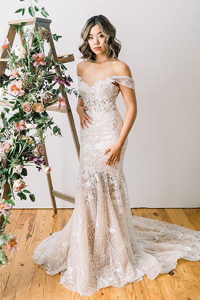 Hannah wearing her lace trumpet wedding dress
