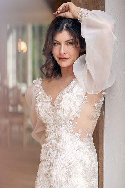 Lauren wearing her wedding dress with sleeves