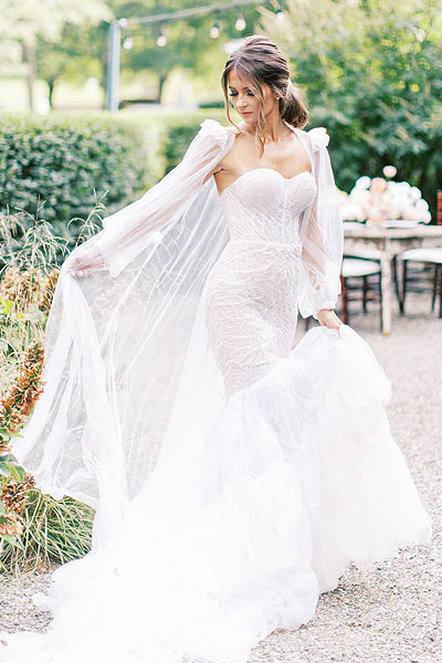 Oksana wearing her custom wedding dress with sleeves
