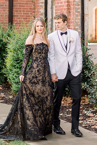 Payton walking in her black wedding gown