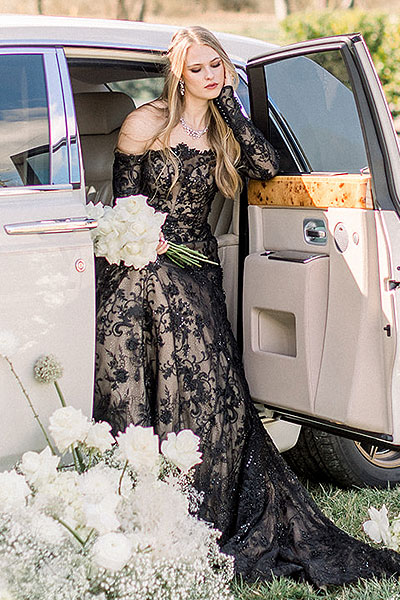 Payton waiting in the limo in her black custom wedding dress