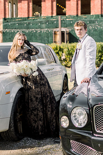 Payton and worth posing with matching black and white Bentleys