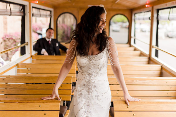 Sherri in a train car in her wedding dress