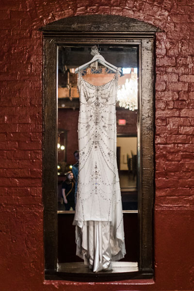 Sherri's custom bridal gown on a hanger