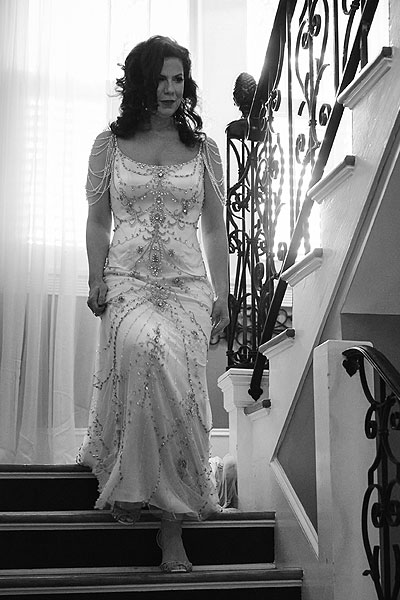 Sherri descending stairs in her custom bridal gown