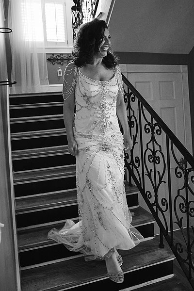 Sherri coming down the stairs in her wedding dress