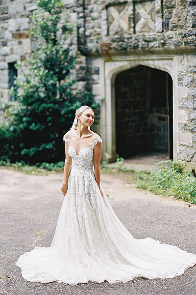 Natalie posing in her custom wedding gown