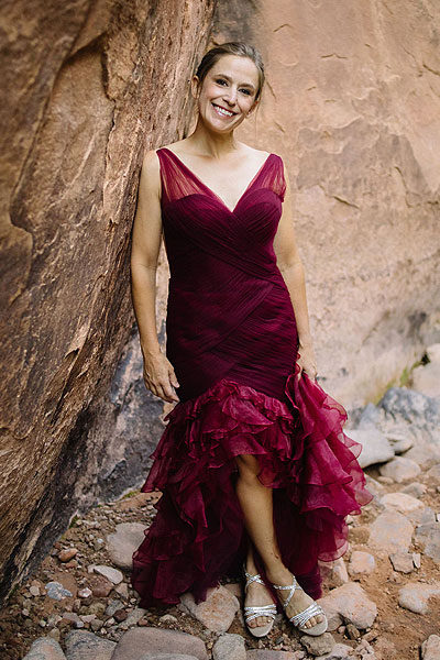 Whitney wearing her red wedding dress from Angela Kim Couture