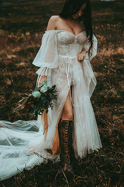 Caroline posing in her sexy boho wedding dress