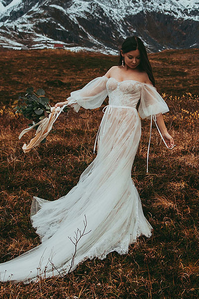 Caroline posing in her romantic boho wedding gown