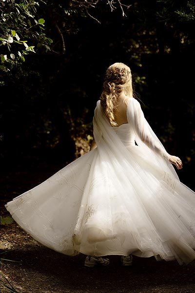 Hannah twirling in her custom wedding gown