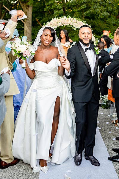 Jenneh and Darell walking the aisle