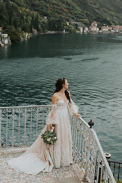 Morgan in her custom wedding dress by the water