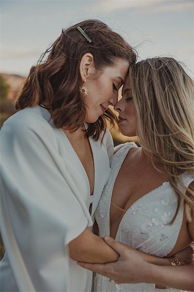 Susan and Madison in a romantic embrace
