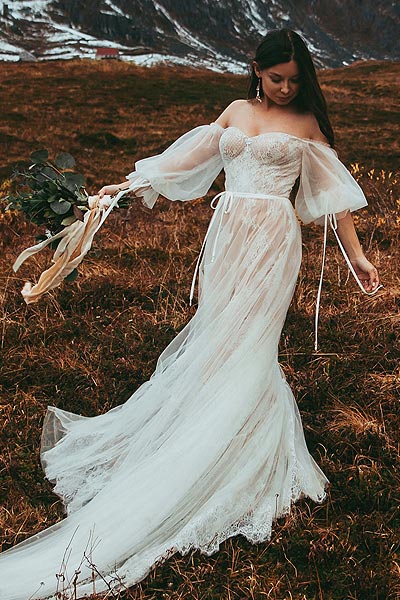 Caroline posing in her custom petite boho wedding dress