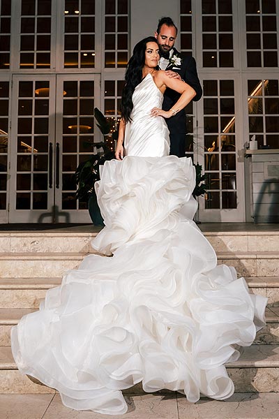 Chelsea posing in her custom bridal gown
