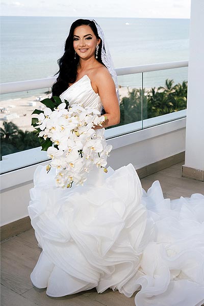 Chelsea wearing her custom bridal gown from Angela Kim Couture