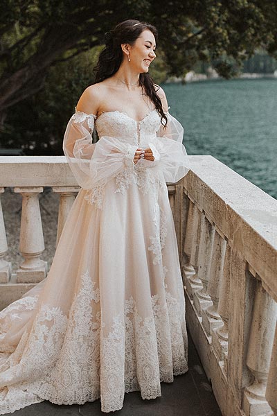 Morgan in her custom wedding dress on a veranda