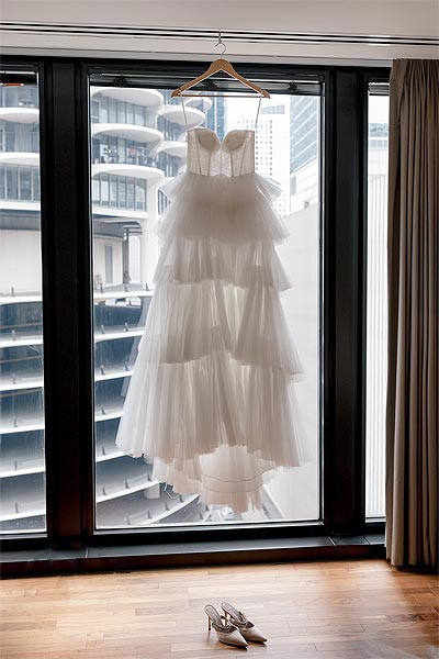 Rachel's wedding dress on a hanger