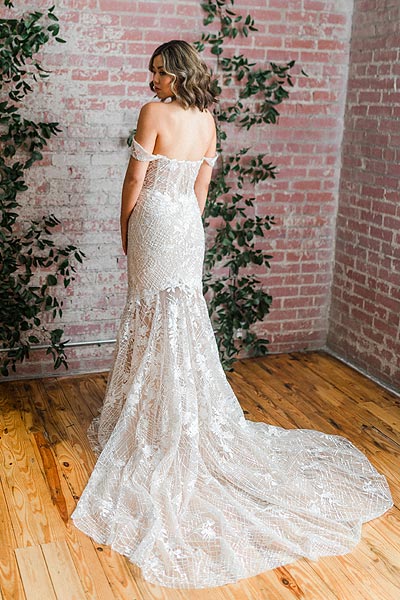 Hannah's wedding gown features a court train