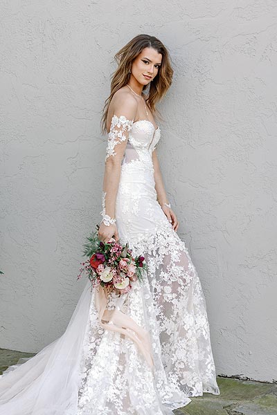 Kyra posing in her custom wedding dress