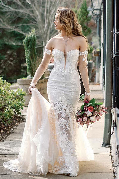 Kyra walking in her custom wedding dress