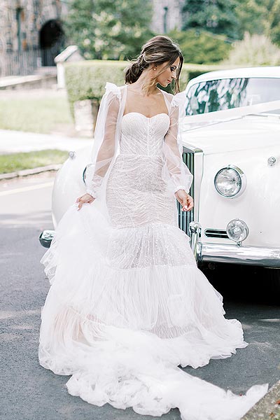Oksana posing in her romantic wedding gown