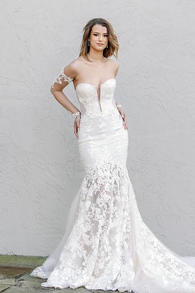 Kyra posing in her custom bridal gown