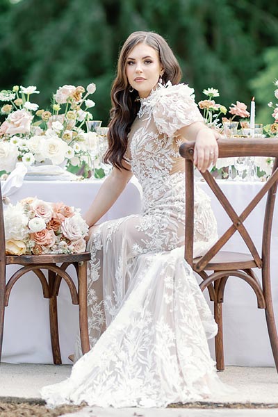 Masha seated in her custom wedding dress