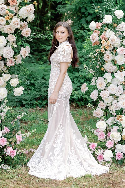 Masha looking over her shoulder in her custom bridal gown