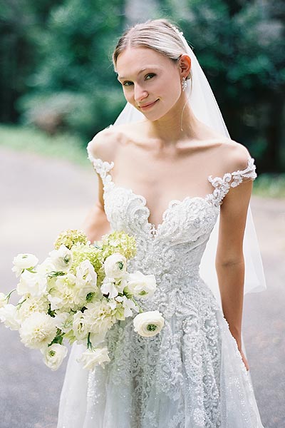 Natalie smiling in her custom wedding dress