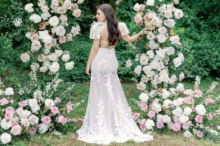 Masha posing in her custom backless wedding dress