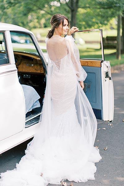Oksana in her open back bridal gown