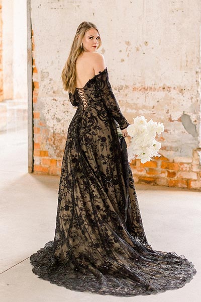 Payton posing in a black open back wedding gown