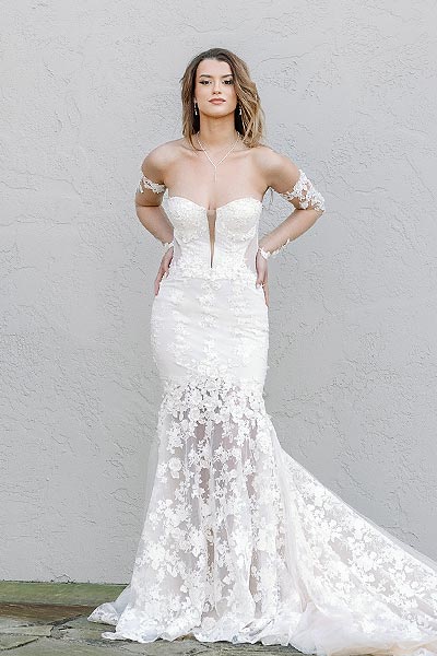 Kyra in a custom bridal gown with a plunging neckline