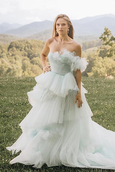 Payton posing in her tulle wedding dress