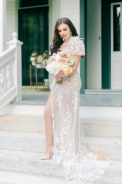 Masha posing in her custom summer wedding gown