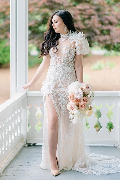 Masha posing in her custom wedding dress