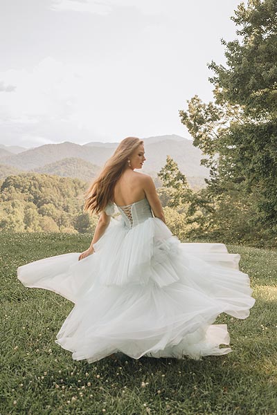 Payton twirling in her summer wedding dress