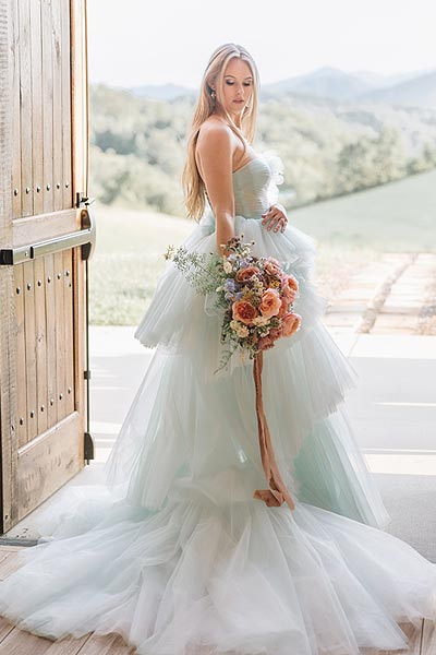 Payton posing in her custom wedding dress