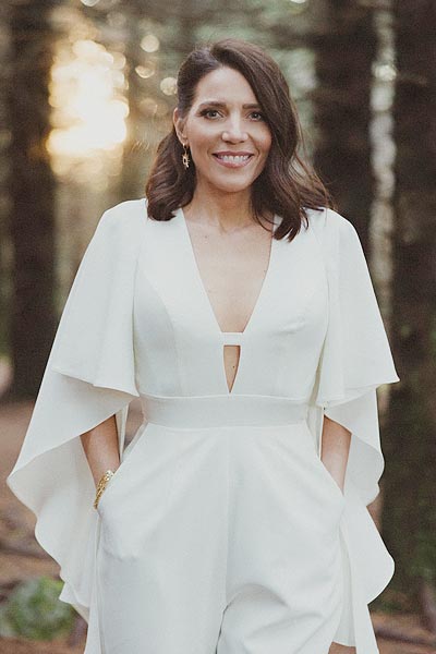 Susan's bridal jumpsuit features butterfly sleeves